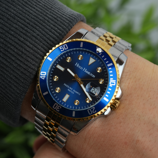 Hugo Hamilton armbåndsur med blå urskive og tofarvet lænke i guld og sølv