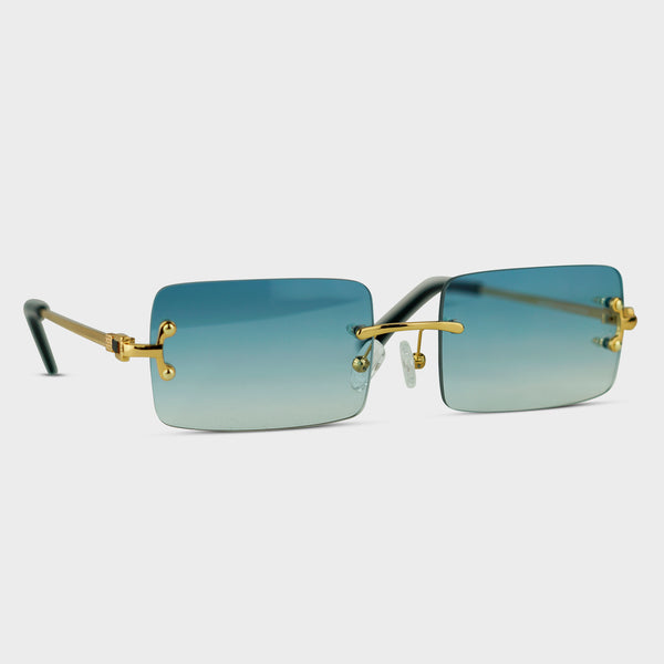 Randløse solbriller med blå gradient glas og guldstænger